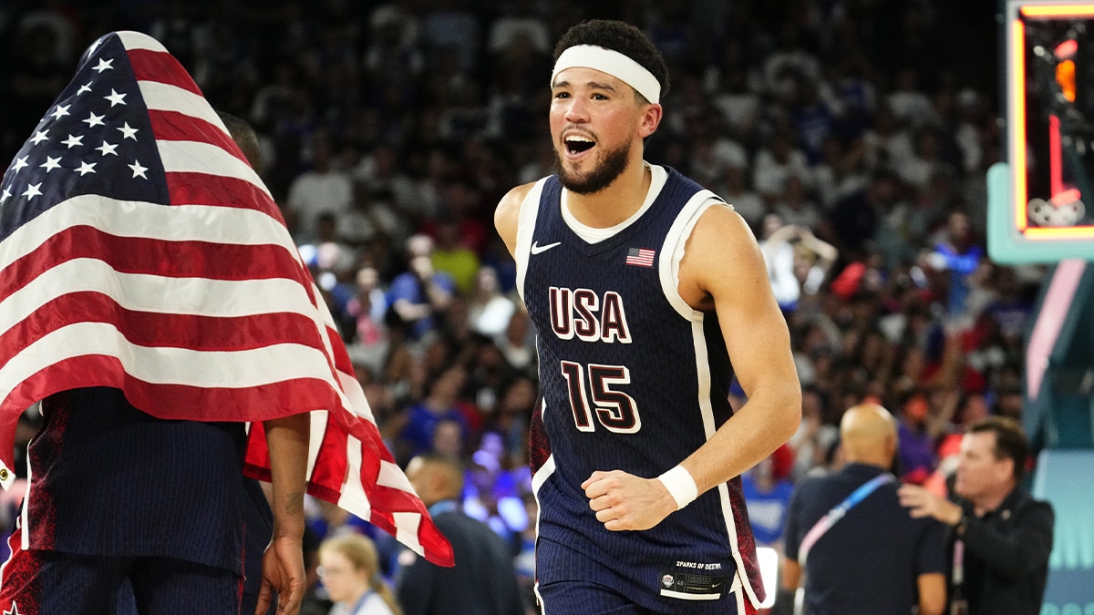 United States guard Devin Booker (15) celebrates after defeating France in the men's basketball gold medal game during the Paris 2024 Olympic Summer Games at Accor Arena.