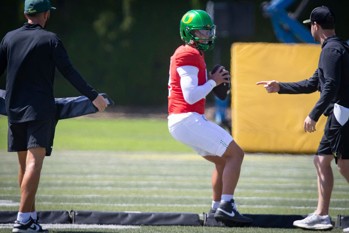 Oregon quarterback Dillon Gabriel looks to pass during the Ducks’ fall camp