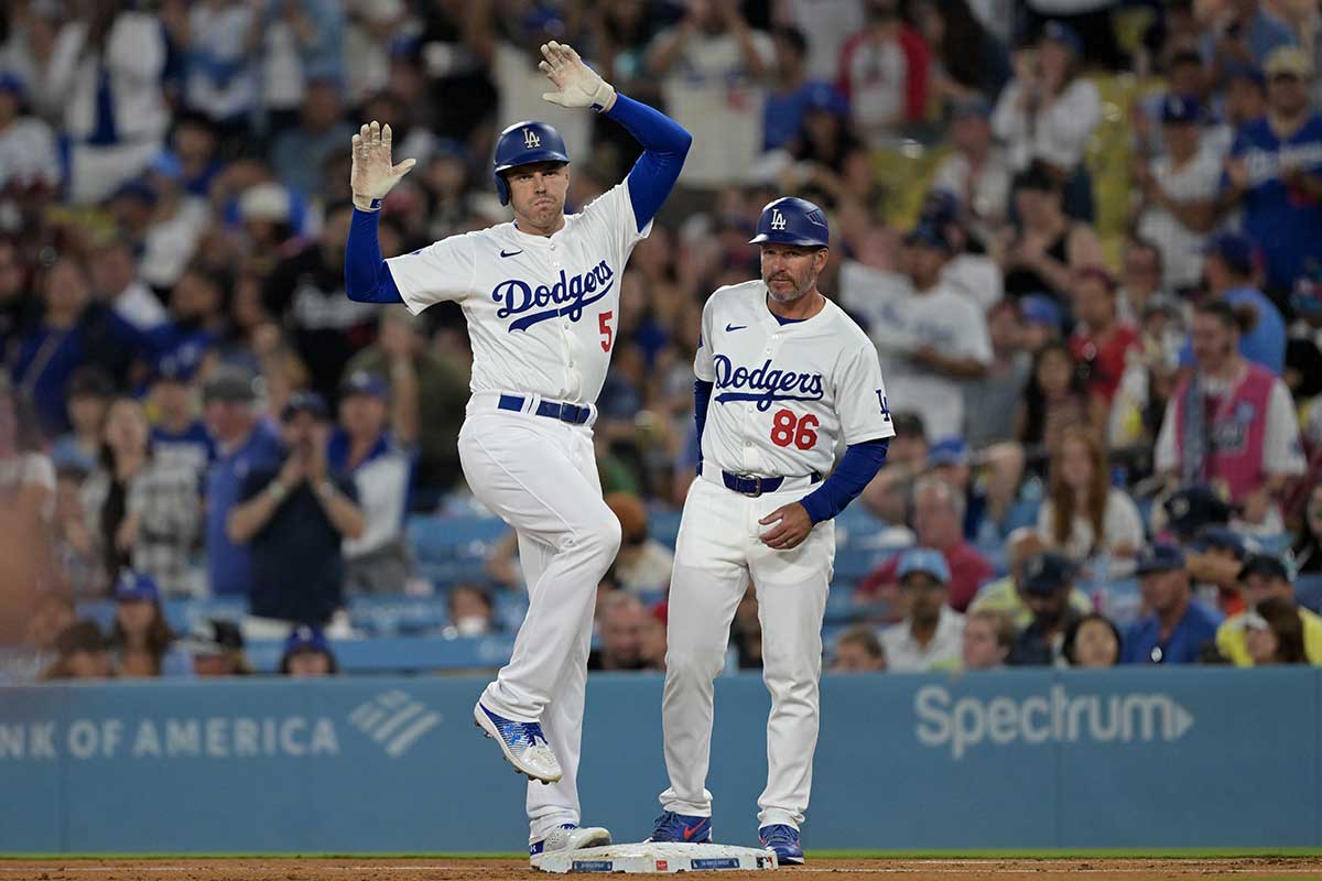 Los Angeles Dodgers first baseman Freddie Freeman (5) on first after hitting a single in the third inning against the Philadelphia Phillies at Dodger Stadium. 