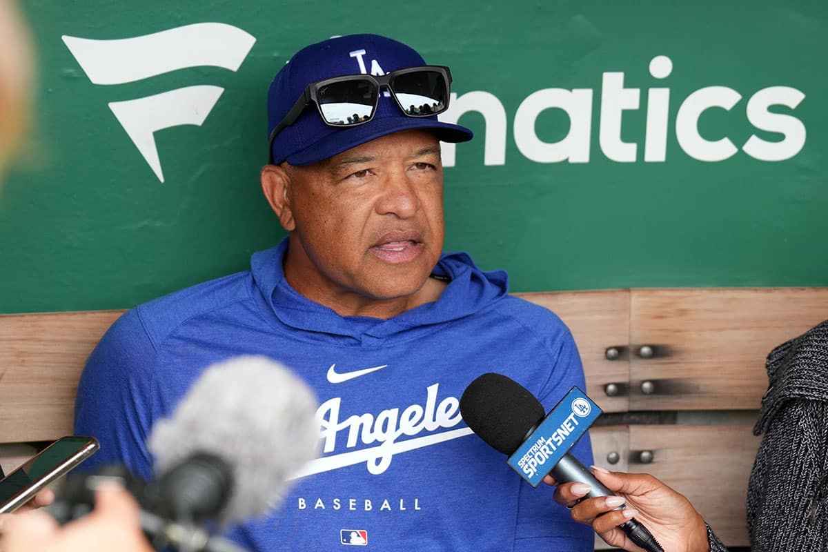 Aug 4, 2024; Oakland, California, USA; Los Angeles Dodgers manager Dave Roberts (30) talks to media members before the game against the Oakland Athletics at Oakland-Alameda County Coliseum.