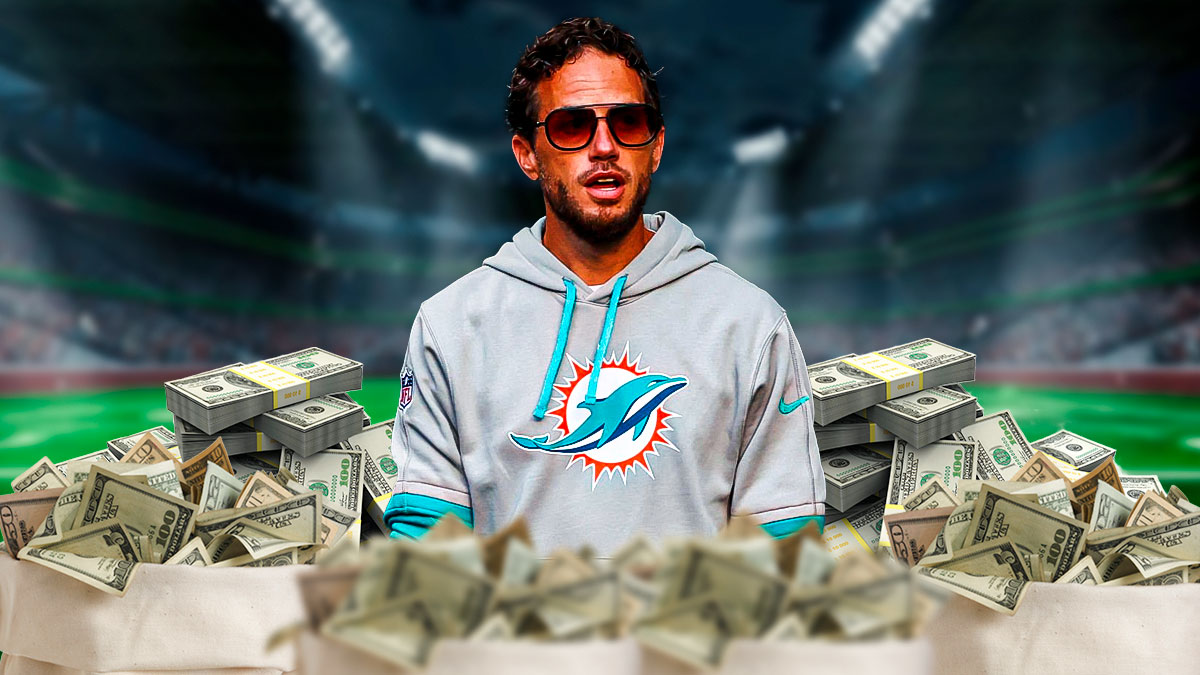 Miami Dolphins head coach Mike McDaniel in front of money and Hard Rock Stadium.