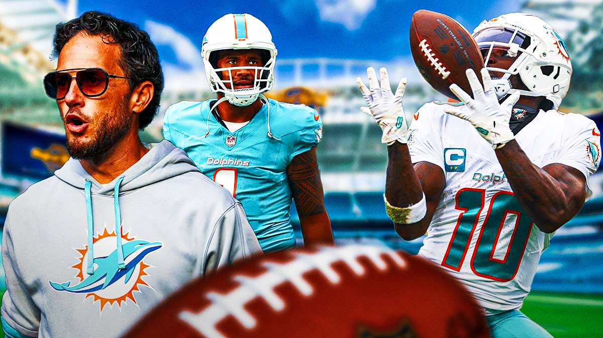 Dolphins Tyreek Hill catching a football on right. Dolphins Mike McDaniel, Dolphins Tua Tagovailoa both standing on left.