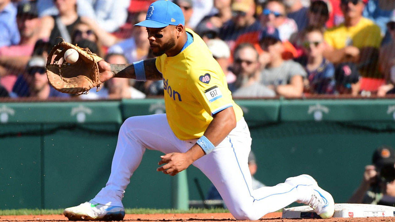 Boston Red Sox first baseman Dominic Smith (2) fields the ball for an out during the third inning against the Houston Astros at Fenway Park.