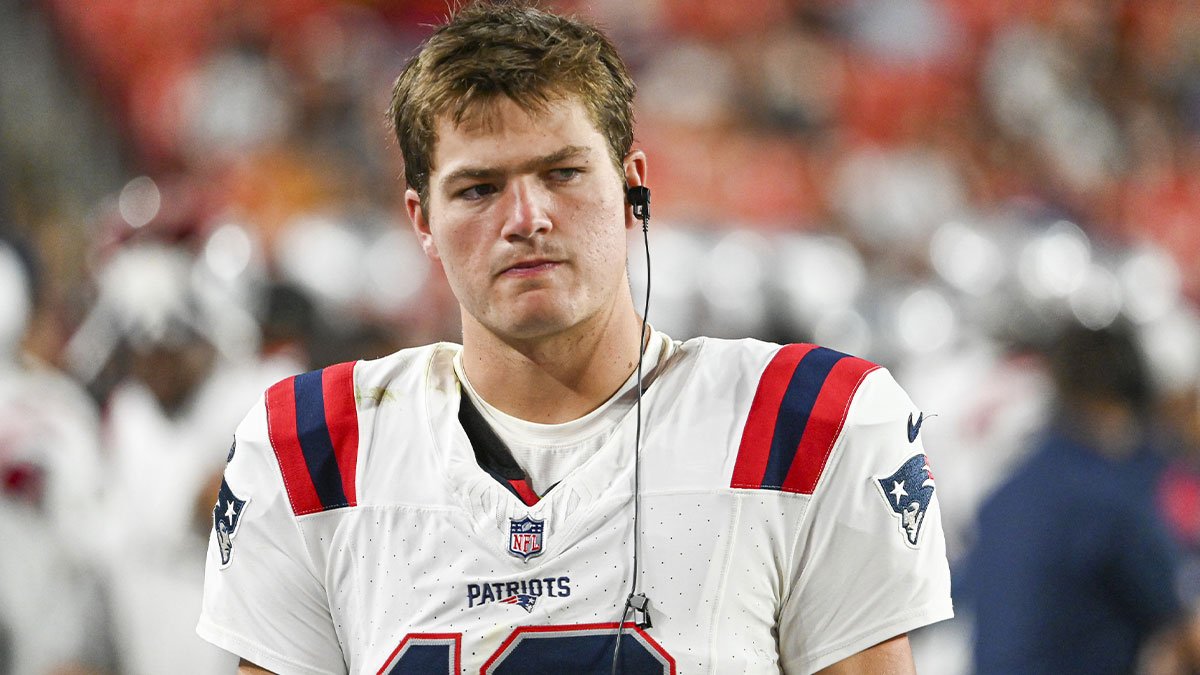 New England Patriots quarterback Drake Maye (10) stands in the bench area during the second half against the Washington Commanders at Commanders Field. 