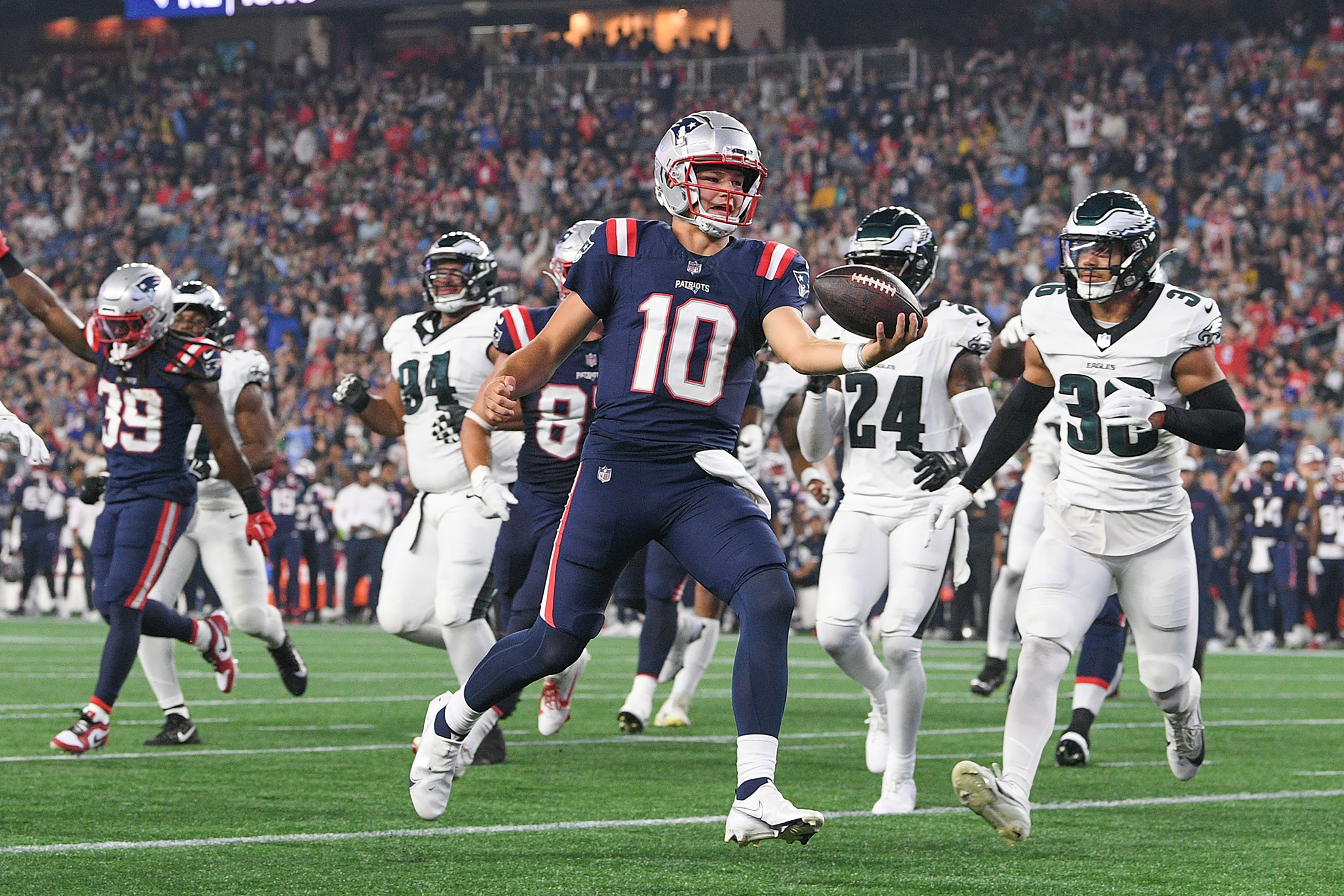 New England Patriots quarterback Drake Maye (10) runs the ball in for a touchdown against the Philadelphia Eagles during the first half at Gillette Stadium.