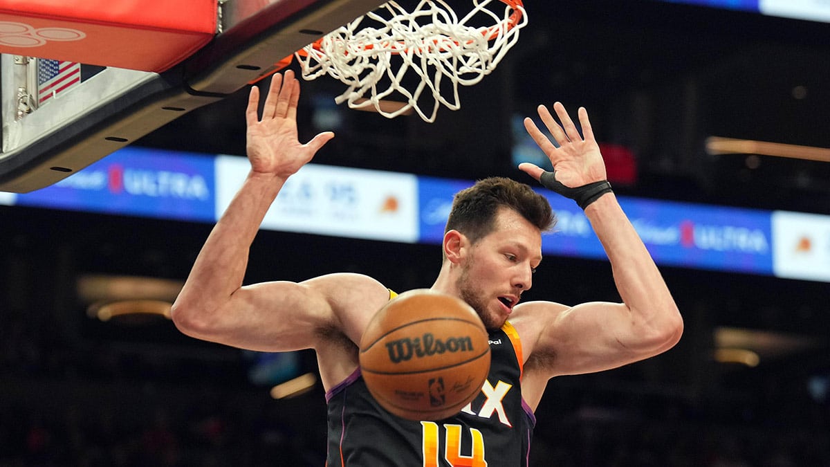 Apr 26, 2024; Phoenix, Arizona, USA; Phoenix Suns forward Drew Eubanks (14) dunks against the Minnesota Timberwolves during the second half of game three of the first round for the 2024 NBA playoffs at Footprint Center.