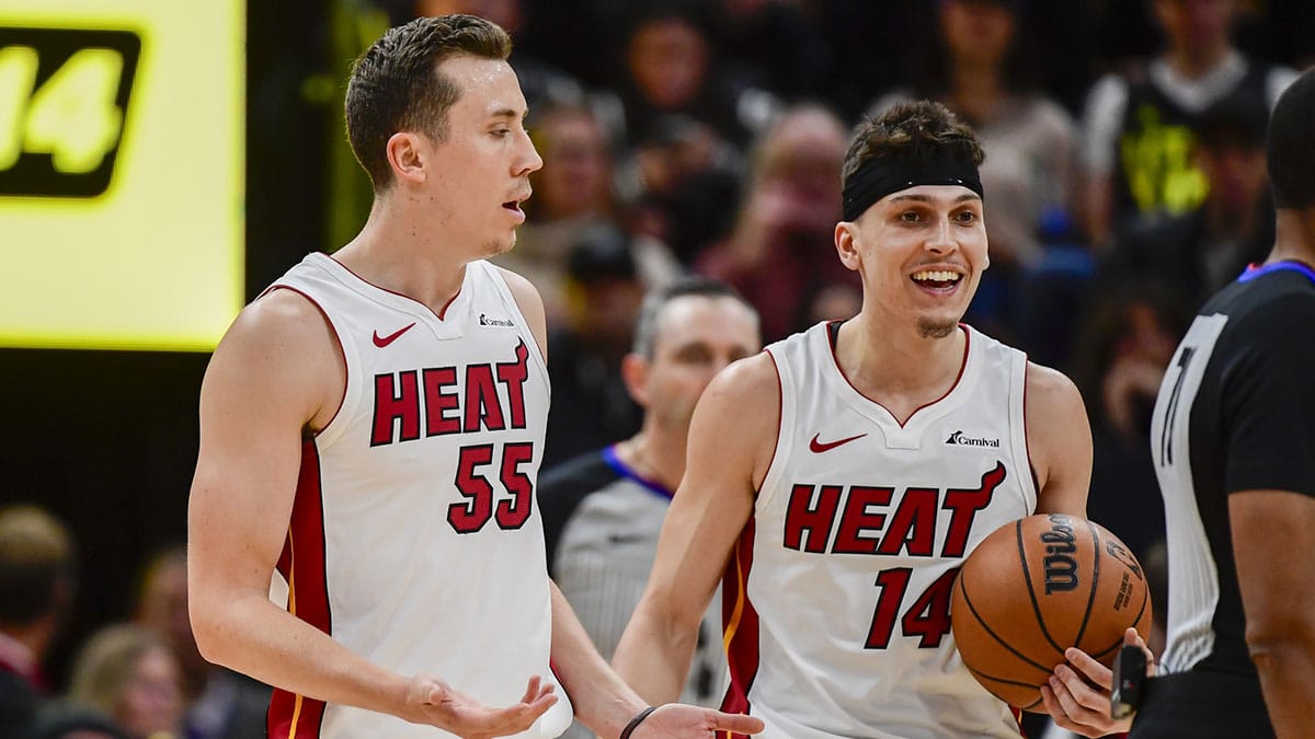 Miami Heat forward Duncan Robinson (55) and guard Tyler Herro (14) react after a call against the Utah Jazz during the second half at Vivint Arena.