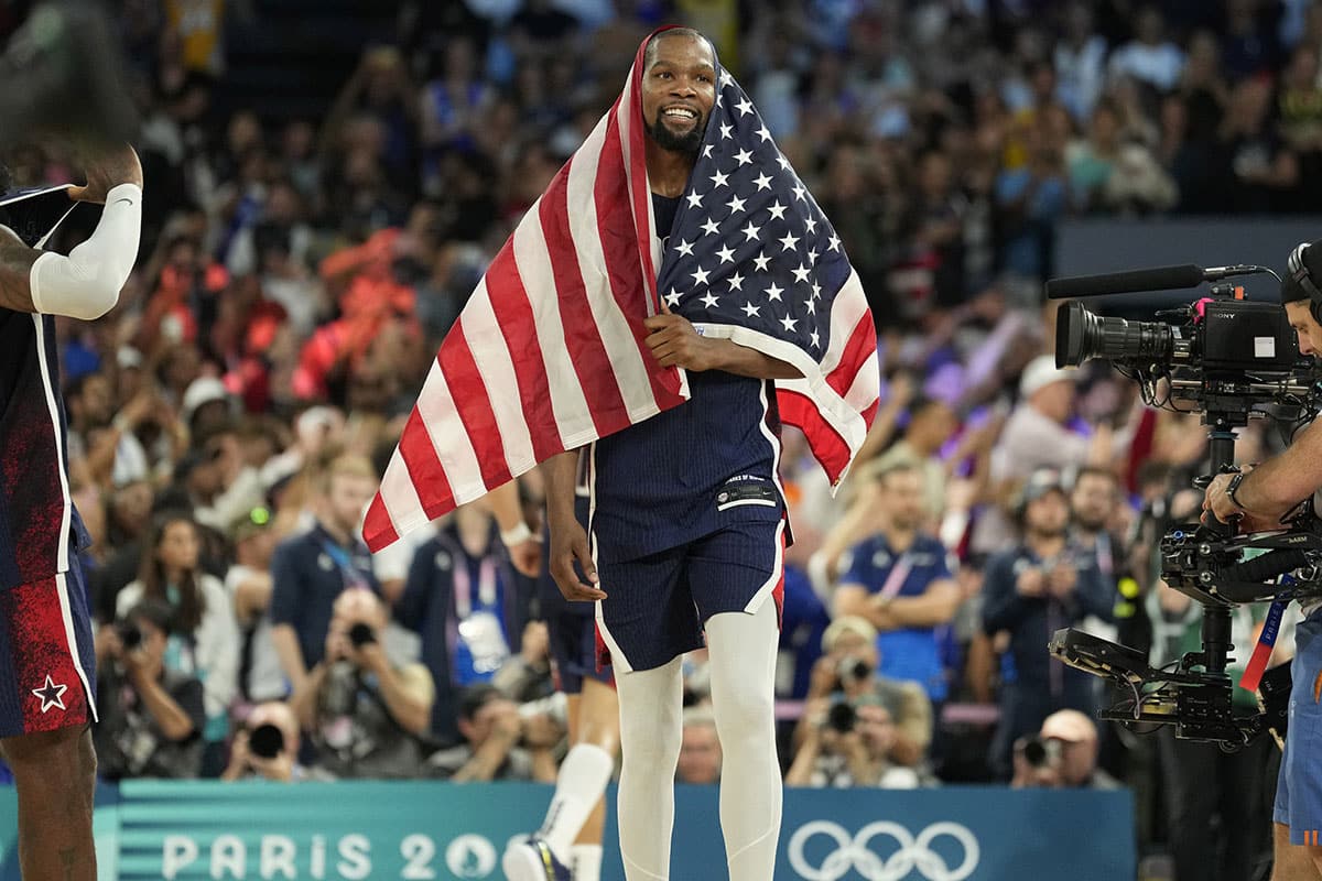 United States guard Kevin Durant (7) celebrates after defeating France in the men's basketball gold medal game during the Paris 2024 Olympic Summer Games at Accor Arena.