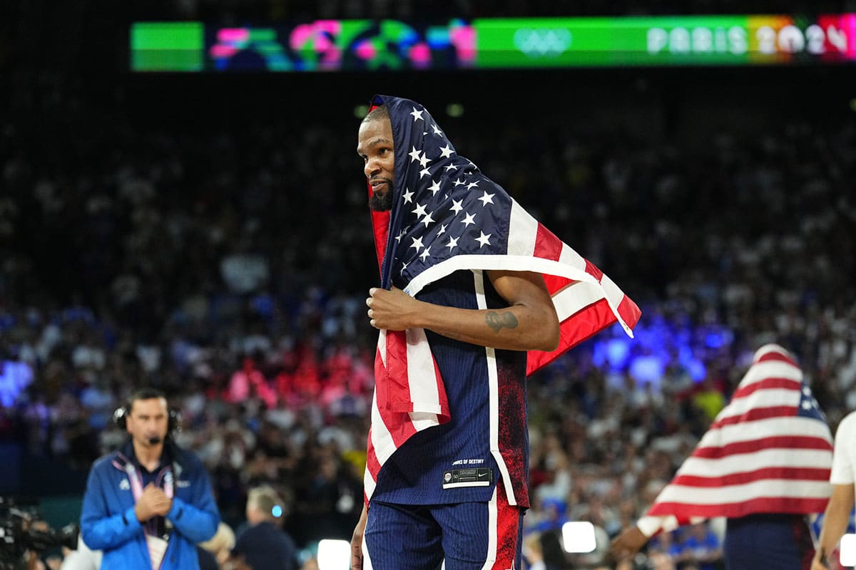 United States guard Kevin Durant (7) celebrates after defeating France in the men's basketball gold medal game during the Paris 2024 Olympic Summer Games at Accor Arena. 