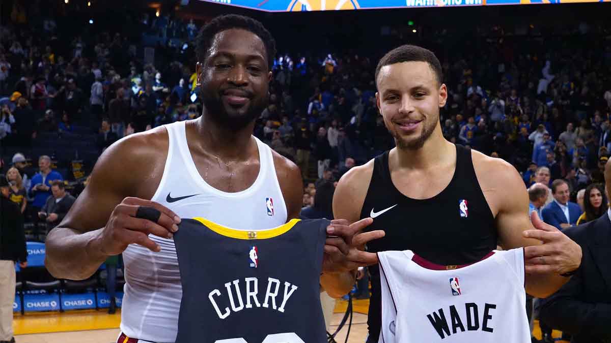 Miami Heat guard Dwyane Wade (3) and Golden State Warriors guard Stephen Curry (30) exchange jerseys