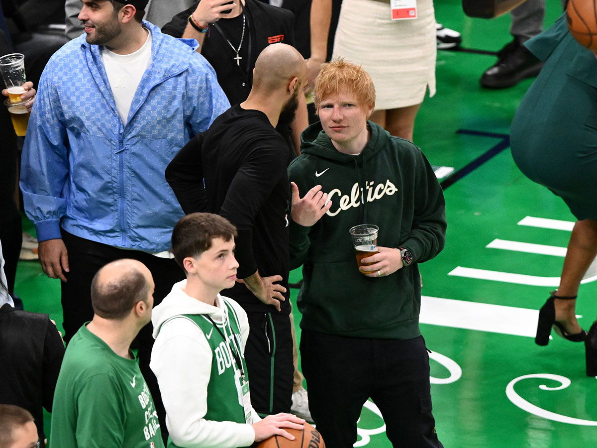 Ed Sheeran talking to Celtics' Derrick White during game on May 23, 2024.