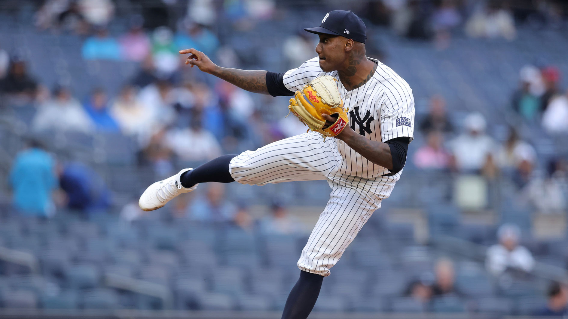 Aug 7, 2024; Bronx, New York, USA; New York Yankees relief pitcher Enyel de los Santos (62) follows through on a pitch against the Los Angeles Angels during the sixth inning at Yankee Stadium. 