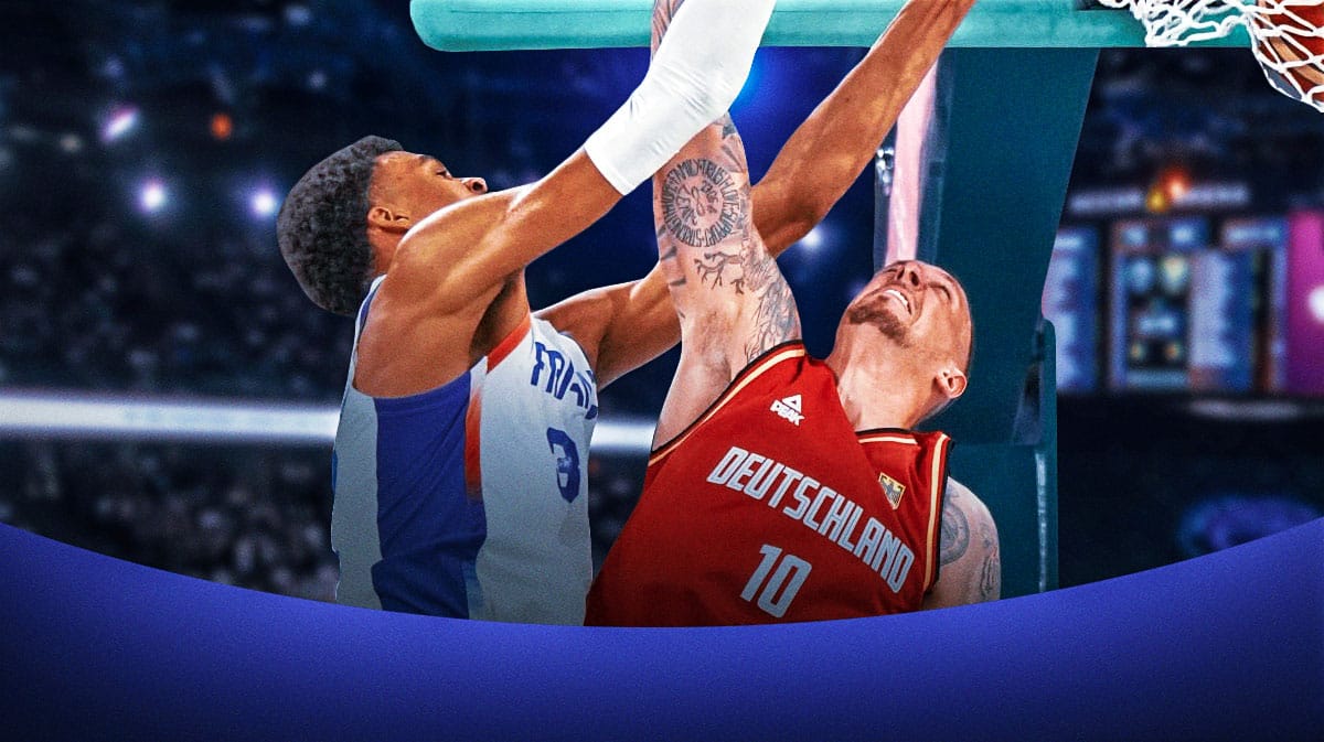 Victor Wembanyama of France dunking on Daniel Theis of Germany