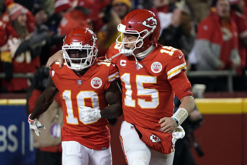 Kansas City Chiefs wide receiver Tyreek Hill (10) celebrates his touchdown with quarterback Patrick Mahomes (15) against the Buffalo Bills during the second half of the AFC Divisional Playoff football game at GEHA Field at Arrowhead Stadium. 