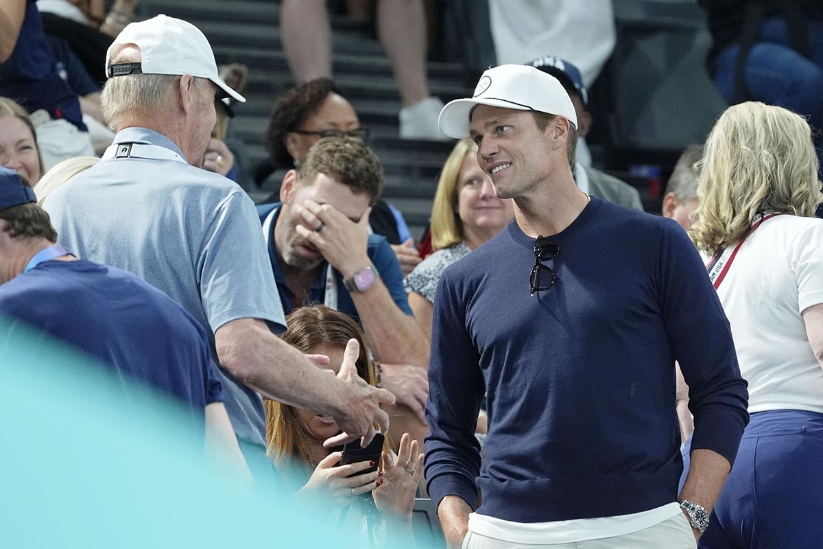 Stan Smith talks with Tom Brady on day three of the gymnastics event finals during the Paris 2024 Olympic Summer Games. Mandatory Credit: Jack Gruber-USA TODAY Sports