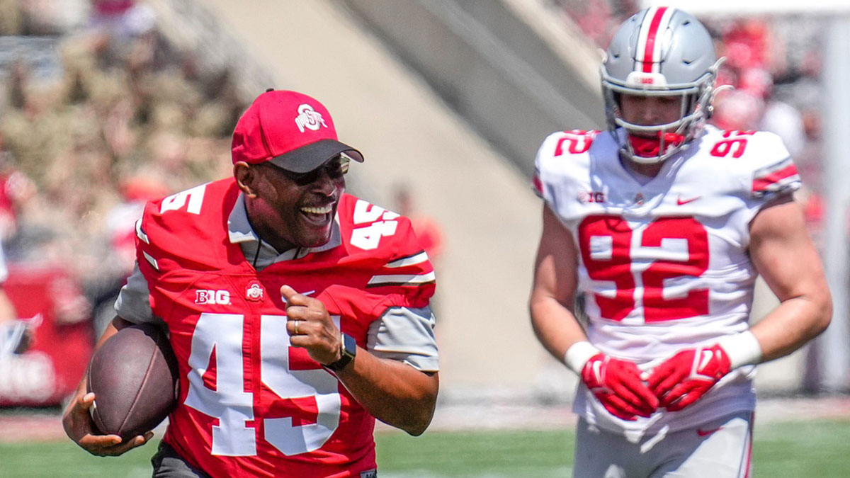 Ohio State Buckeyes alumni Archie Griffin runs the ball down the field during the third quarter of the Ohio State Buckeyes spring game at Ohio Stadium on Saturday morning. 