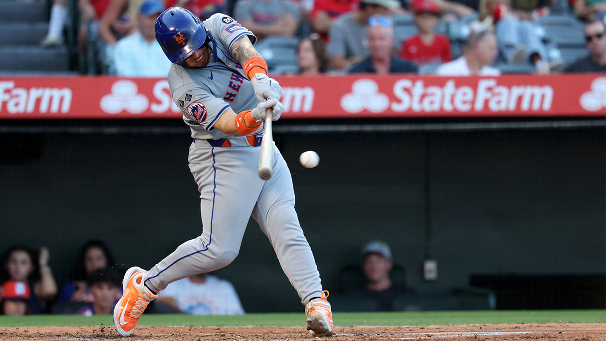 New York Mets catcher Francisco Alvarez (4) hits an RBI single during the second inning against the Los Angeles Angels at Angel Stadium.