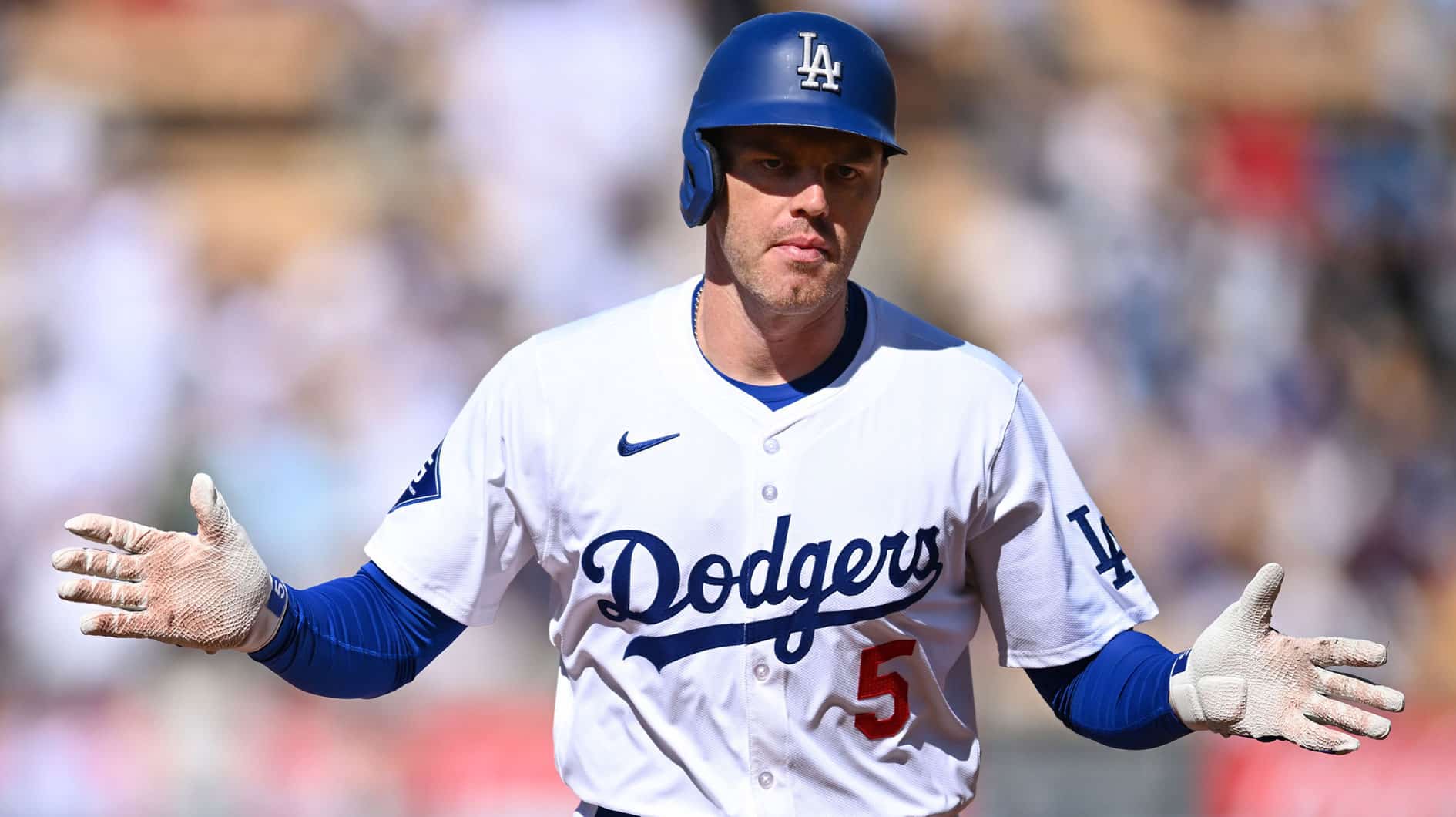 Los Angeles Dodgers first baseman Freddie Freeman (5) celebrates after hitting a home run against the Boston Red Sox during the first inning at Dodger Stadium.