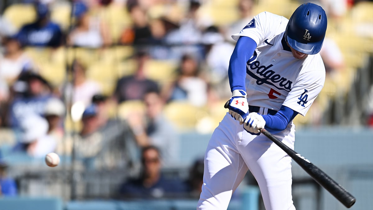 Jul 21, 2024; Los Angeles, California, USA; Los Angeles Dodgers first baseman Freddie Freeman (5) hits a home run against the Boston Red Sox during the first inning at Dodger Stadium. Mandatory Credit: Jonathan Hui-USA TODAY Sports