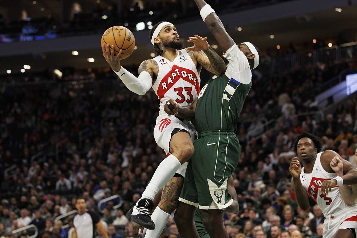 Toronto Raptors guard Gary Trent Jr. (33) shoots against Milwaukee Bucks forward Bobby Portis (9) during the fourth quarter at Fiserv Forum. 