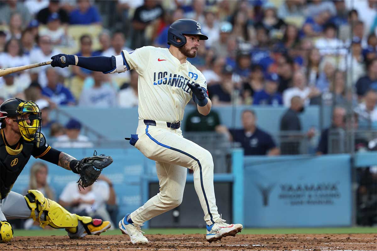 Los Angeles Dodgers second baseman Gavin Lux (9) hits an RBI single during the third inning against the Pittsburgh Pirates at Dodger Stadium