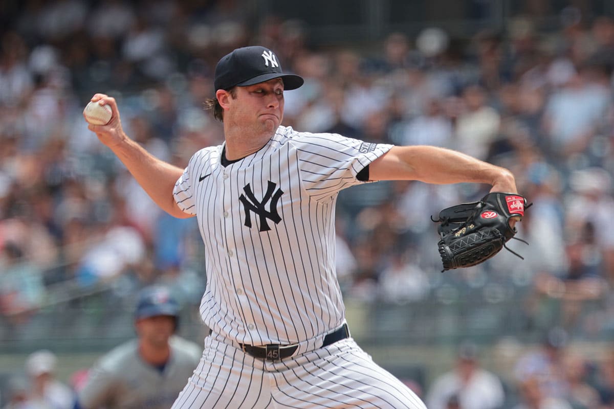 New York Yankees starting pitcher Gerrit Cole (45) delivers a pitch during the first inning against the Toronto Blue Jays at Yankee Stadium. 