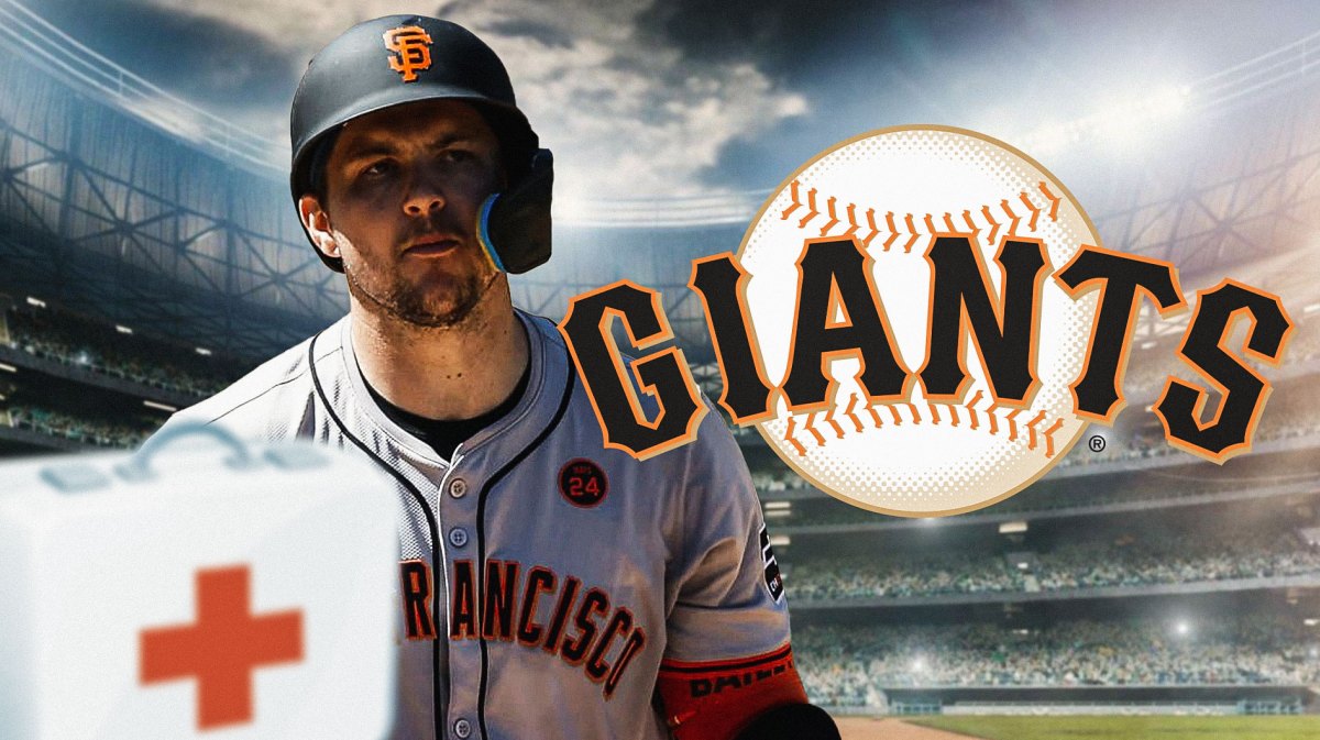 Patrick Bailey beside a first-aid box with San Francisco Giants logo behind him