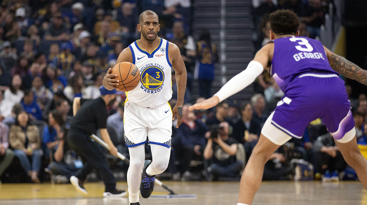 Golden State Warriors guard Chris Paul (3) brings the ball up court against the Utah Jazz during the first quarter at Chase Center. 