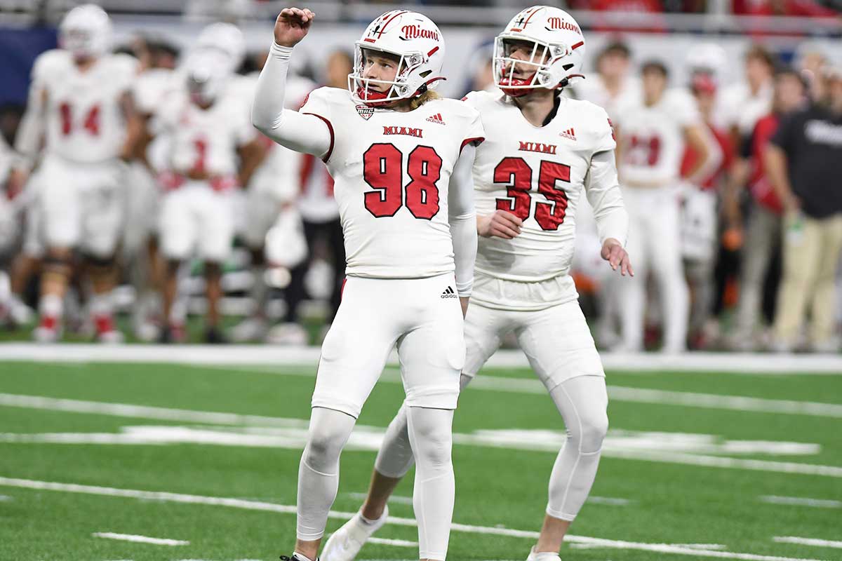 Miami (OH) Redhawks place kicker Graham Nicholson (98) and holder Alec Bevelhimer (35) watch as a field goal by Nicholson goes through the uprights against the Toledo Rockets in the first quarter at Ford Field.