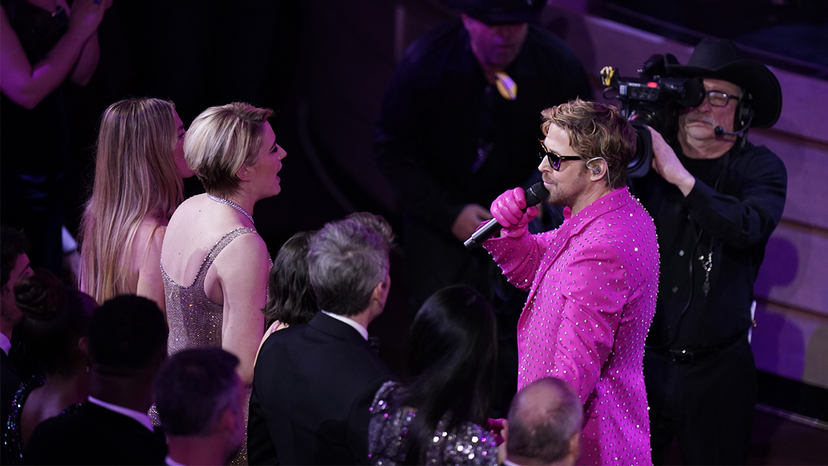 Greta Gerwig and Ryan Gosling at the Oscars during performance of I'm Just Ken.