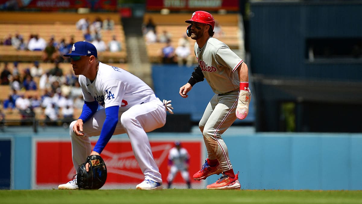 Philadelphia Phillies designated hitter Bryce Harper (3) leads off against Los Angeles Dodgers first baseman Freddie Freeman (5) during the fourth inning at Dodger Stadium.