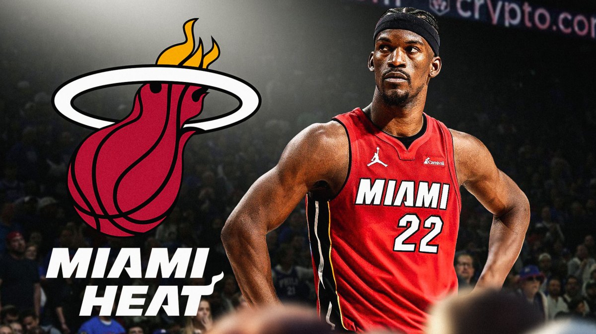 Jimmy Butler beside Miami Heat logo