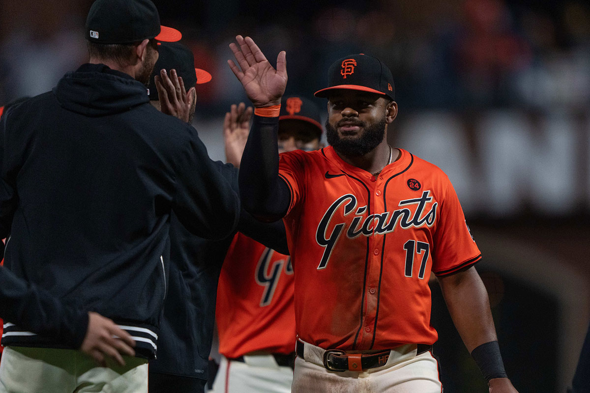 San Francisco Giants outfielder Heliot Ramos (17) celebrates with his teammates after defeating the Colorado Rockies at Oracle Park.
