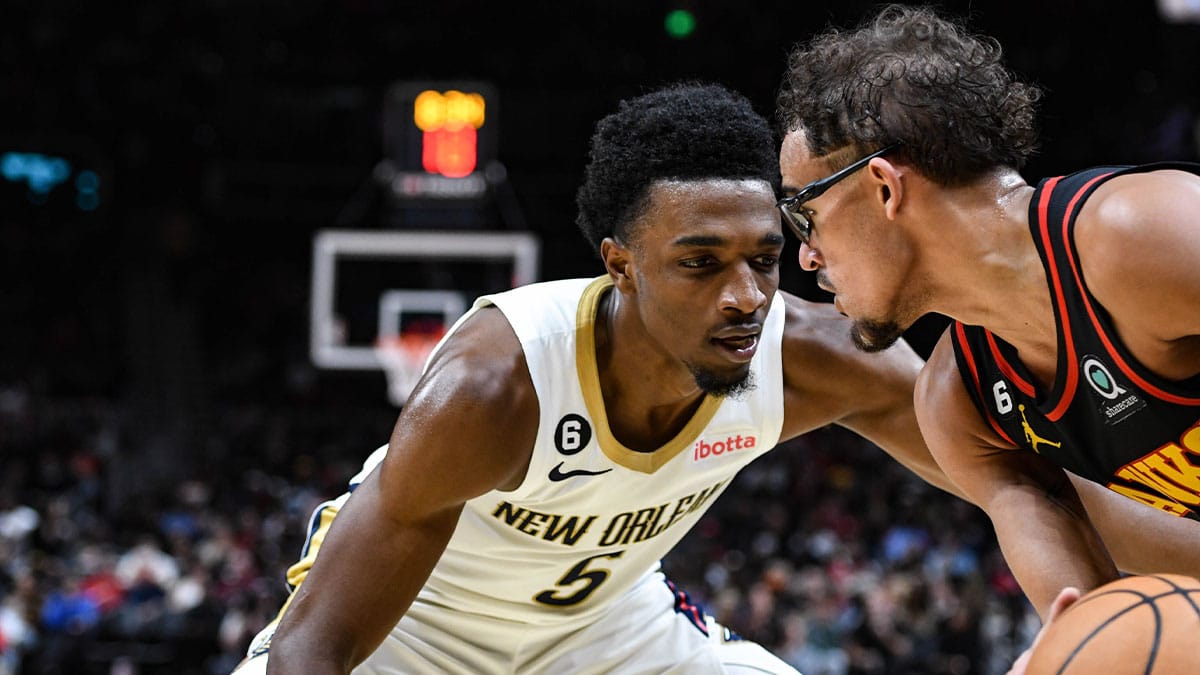 New Orleans Pelicans forward Herb Jones (5) pressures Atlanta Hawks guard Trae Young (11) in the third quarter at State Farm Arena.