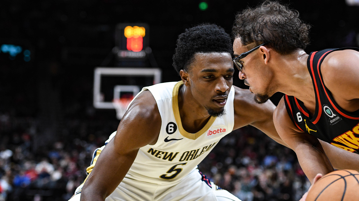 New Orleans Pelicans forward Herb Jones (5) pressures Atlanta Hawks guard Trae Young (11) in the third quarter at State Farm Arena.