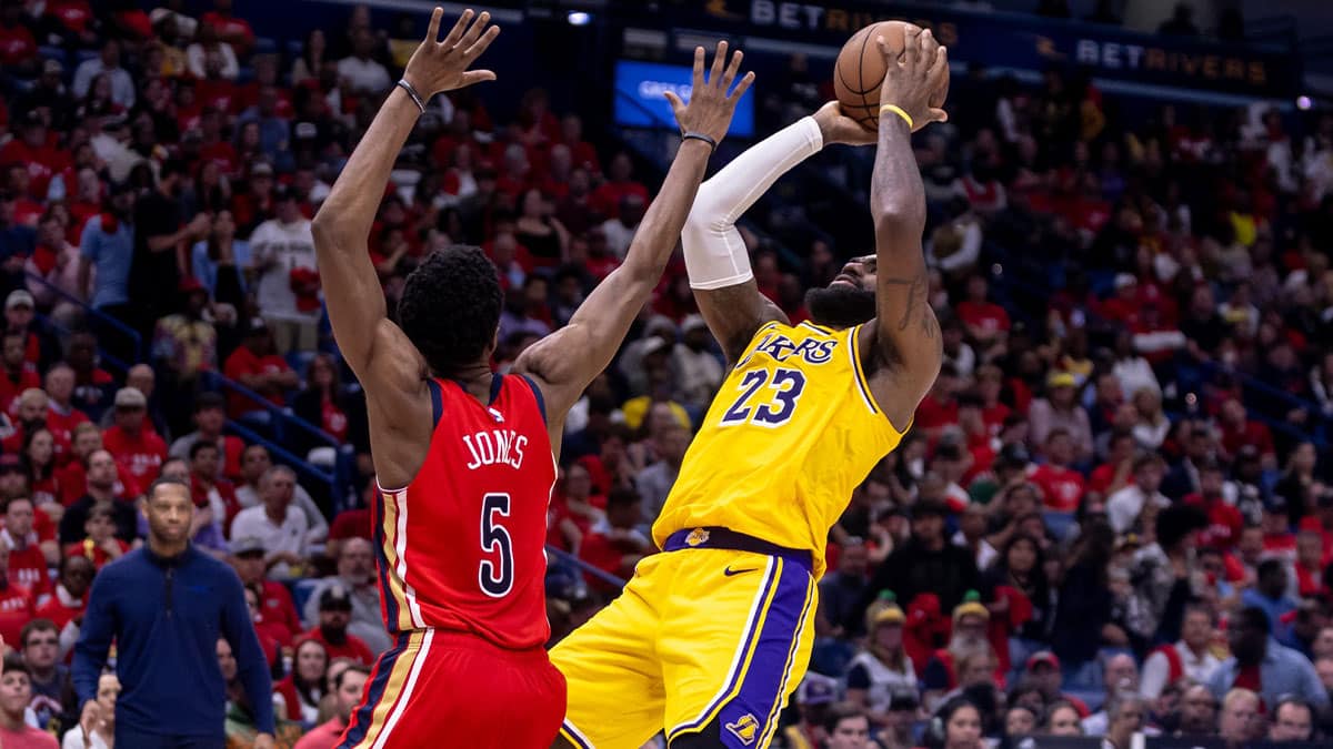 Los Angeles Lakers forward LeBron James (23) shoots against New Orleans Pelicans forward Herbert Jones (5) during the second half of a play-in game of the 2024 NBA playoffs at Smoothie King Center.