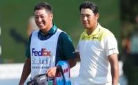 Hideki Matsuyama, right, and caddie Taiga Tabuchi react after winning the FedEx St. Jude Championship Sunday at TPC Southwind