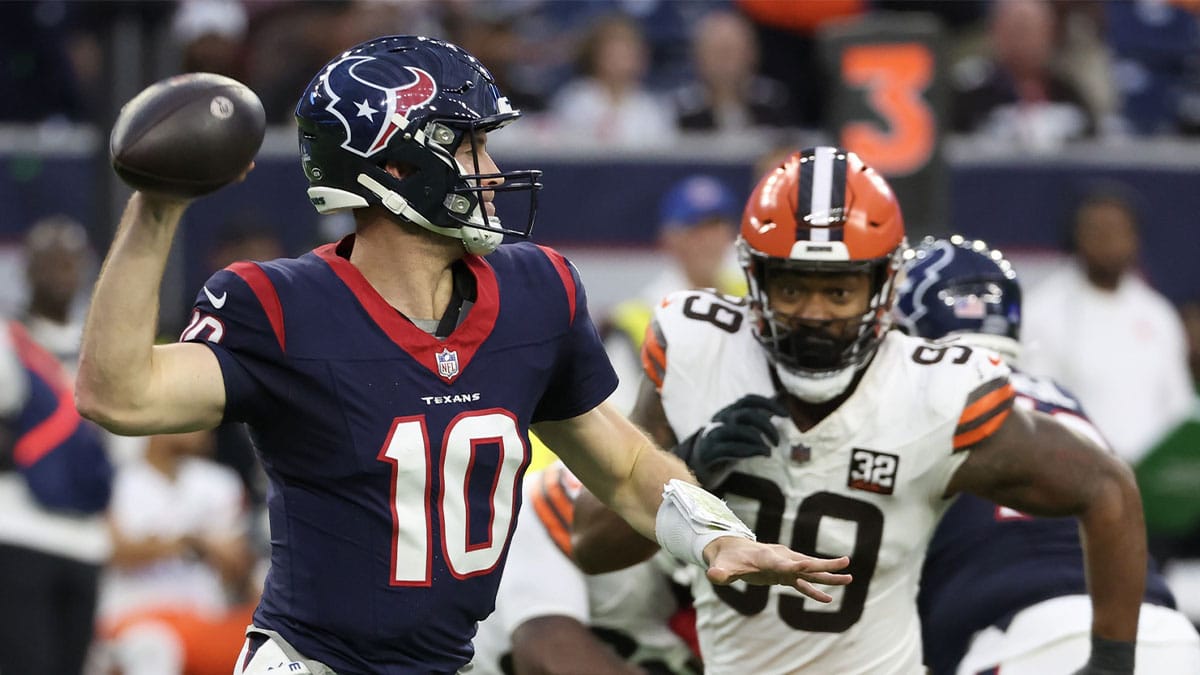 Houston Texans quarterback Davis Mills (10) is pressured in the pocket by Cleveland Browns defensive end Za'Darius Smith (99) in the second half at NRG Stadium. 