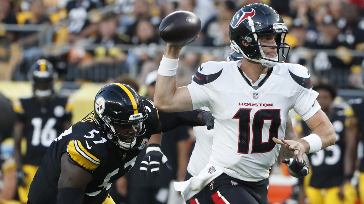 Houston Texans quarterback Davis Mills (10) scrambles with the ball past Pittsburgh Steelers defensive tackle Montravius Adams (57) during the second quarter at Acrisure Stadium. Houston won 20-12. 