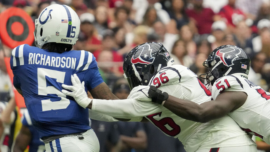 Houston Texans defensive tackle Maliek Collins (96) and Houston Texans defensive end Will Anderson Jr. (51) work to bring down Indianapolis Colts quarterback Anthony Richardson (5) on Sunday, Sept. 17, 2023, during a game against the Houston Texans at NRG Stadium. 