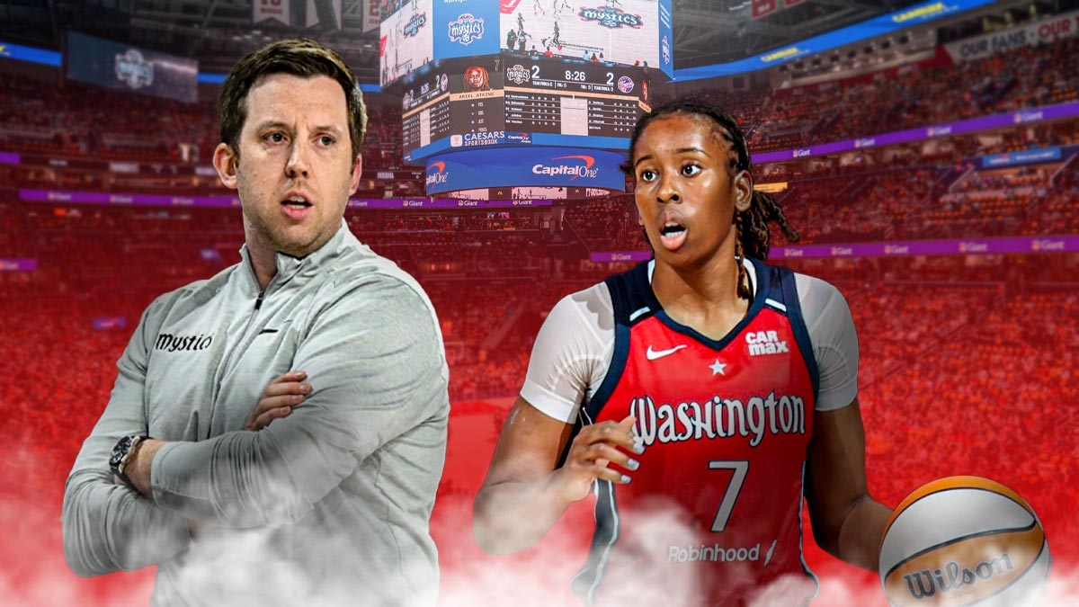 Washington Mystics coach Eric Thibault alongside Washington Mystics player Ariel Atkins with the Mystics arena in the background, season