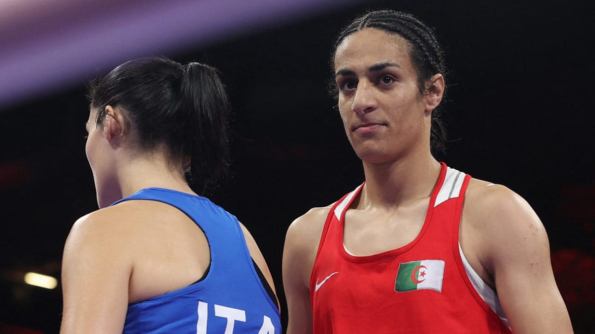Angela Carini of Italy and Imane Khelif of Algeria react after a women's 66kg boxing preliminary bout during the Paris 2024 Olympic Summer Games at North Paris Arena.