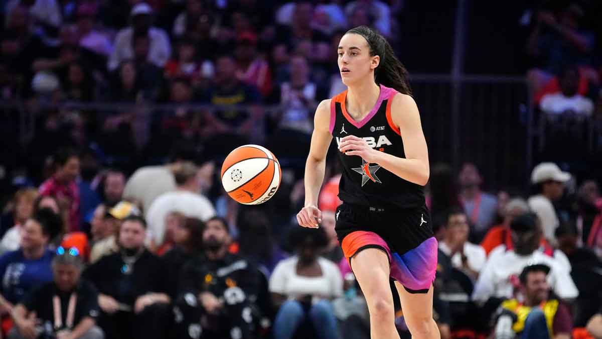 Team WNBA guard Caitlin Clark dribbles up the court against Team USA during the WNBA All-Star Game at Footprint Center in Phoenix on July 20, 2024.