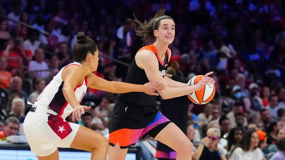 Team WNBA guard Caitlin Clark drives against Team USA guard Kelsey Plum during the WNBA All-Star Game at Footprint Center in Phoenix on July 20, 2024.