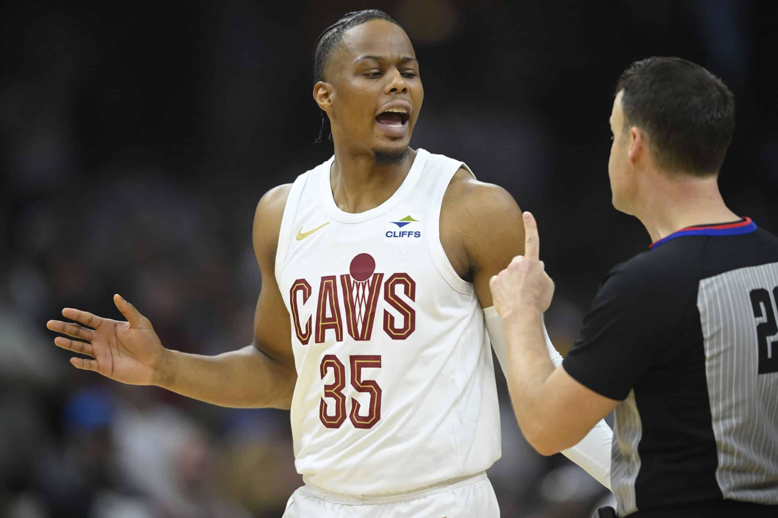 Cleveland Cavaliers forward Isaac Okoro (35) talks with referee Mark Lindsay (29) in the second quarter against the Orlando Magic during game one of the first round for the 2024 NBA playoffs at Rocket Mortgage FieldHouse.