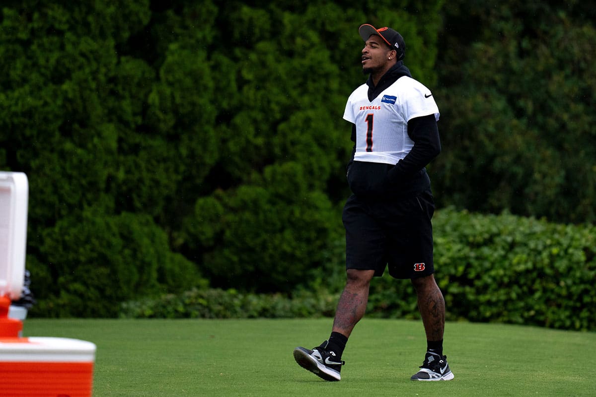 Cincinnati Bengals wide receiver Ja'Marr Chase (1) walks onto the field at Cincinnati Bengals training camp on the Kettering Health Practice Fields