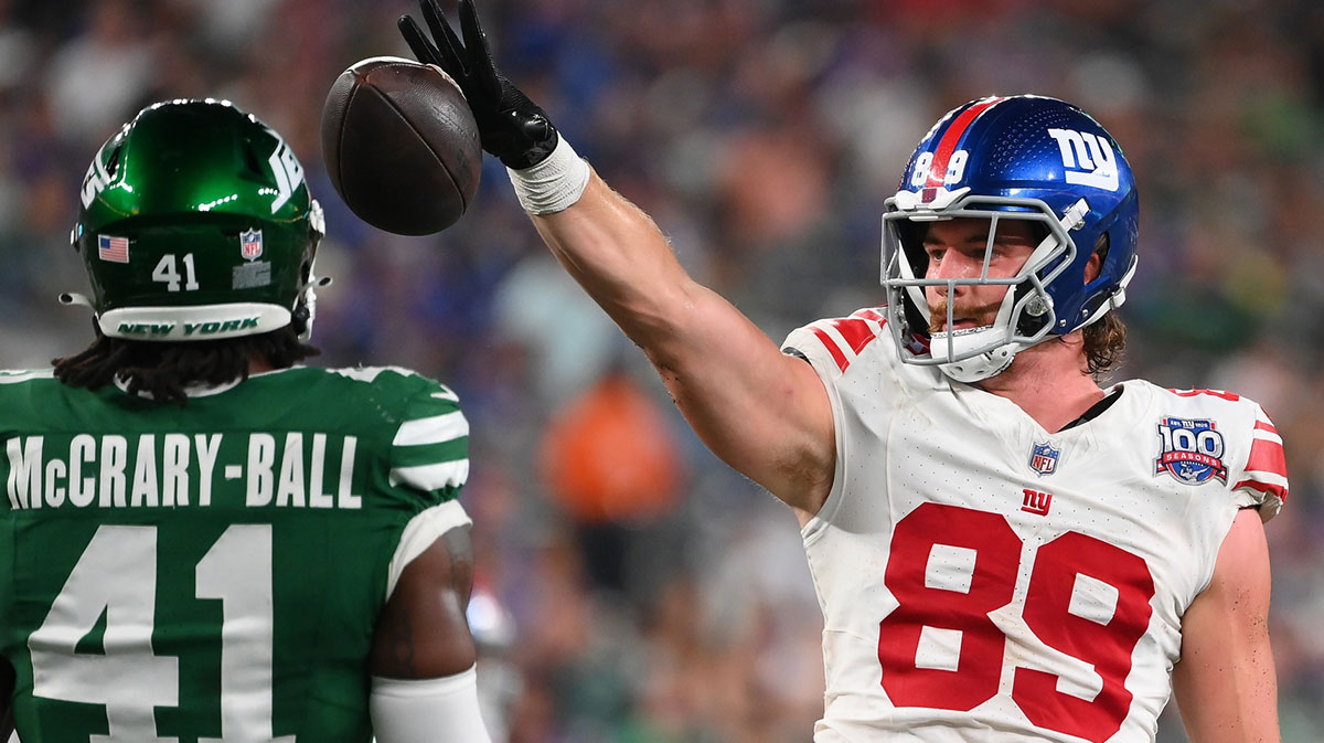 New York Giants tight end Jack Stoll (89) gestures for a first down while dropping the ball as New York Jets linebacker Marcelino McCrary-Ball (41) looks on during the second half at MetLife Stadium.