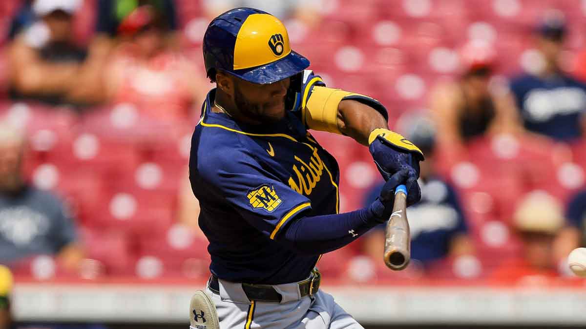 Milwaukee Brewers outfielder Jackson Chourio (11) hits a single in the eighth inning against the Cincinnati Reds at Great American Ball Park.