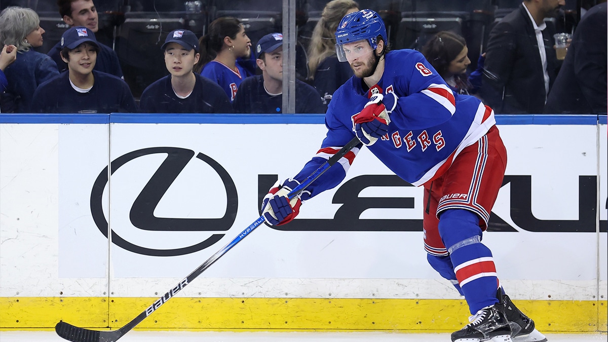 New York Rangers defenseman Jacob Trouba (8) controls the puck against the Florida Panthers during the third period of game one of the Eastern Conference Final of the 2024 Stanley Cup Playoffs at Madison Square Garden. 