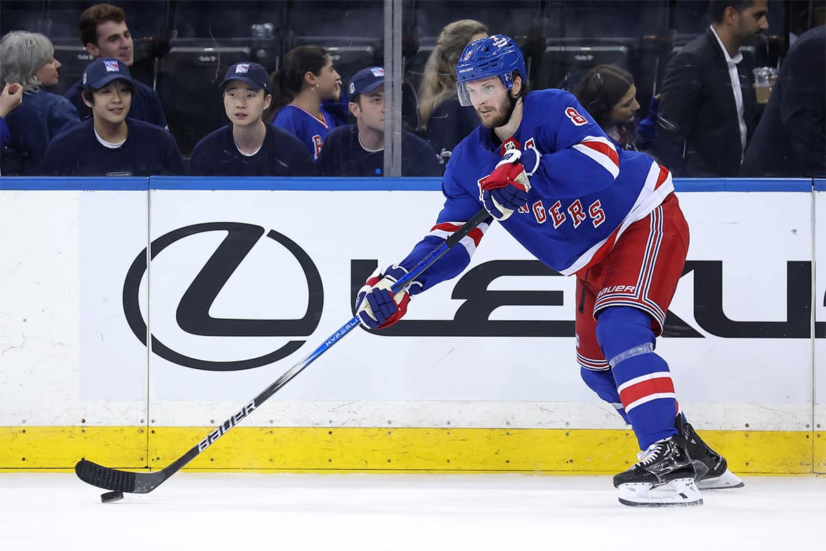 New York Rangers defenseman Jacob Trouba (8) controls the puck against the Florida Panthers during the third period of game one of the Eastern Conference Final of the 2024 Stanley Cup Playoffs at Madison Square Garden.